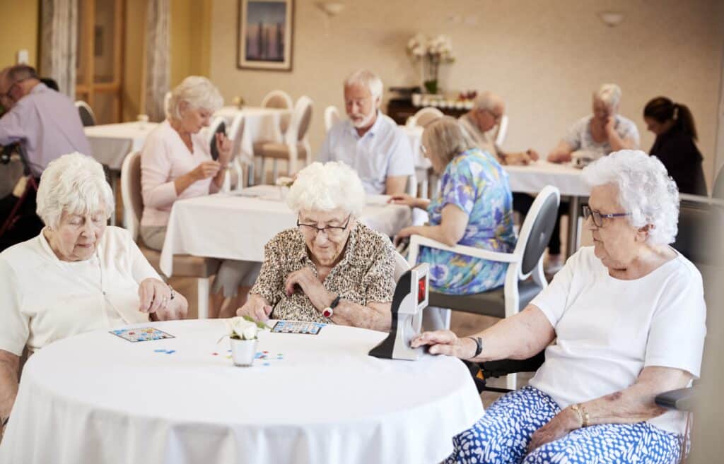 Seniors-at-assisted-living-community-playing-bingo