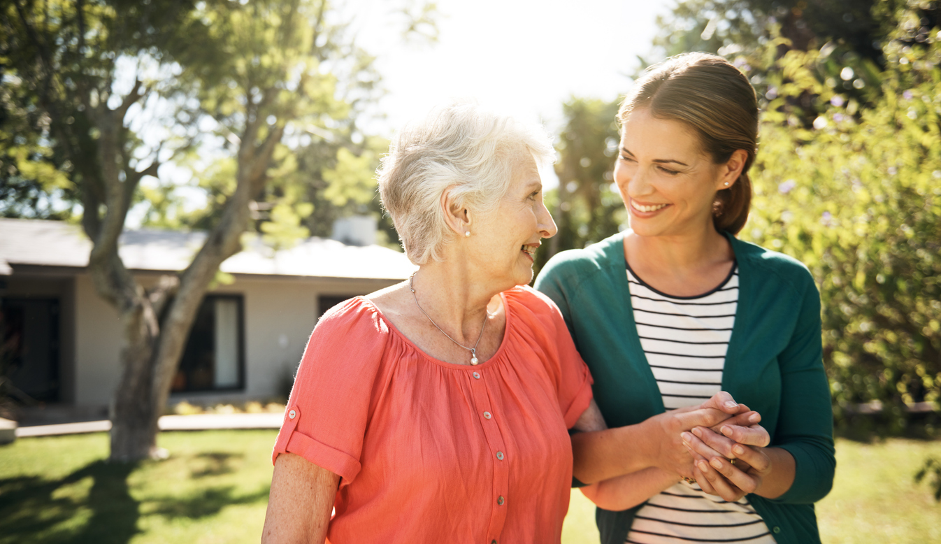 Shot of a young woman going for a walk with her elderly mother in the garden